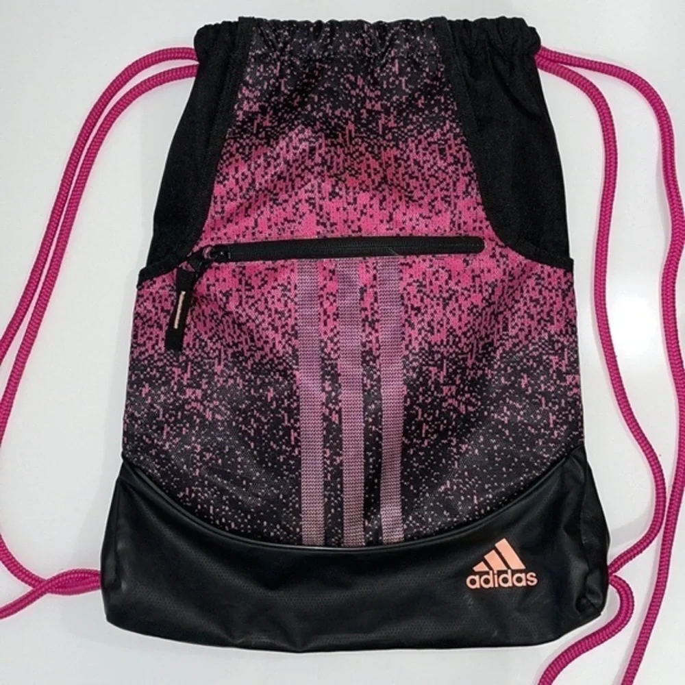 Adidas cinch backpack bag. 13.5” x 18”. Black and pink. Excellent used condition